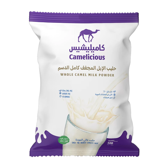 Front packaging of Camelicious Whole Camel Milk Powder 500g showing the brand logo, product name in Arabic and English, and an image of milk splashing into a glass.